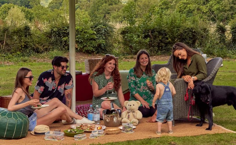 Homewood group with child and dog in garden